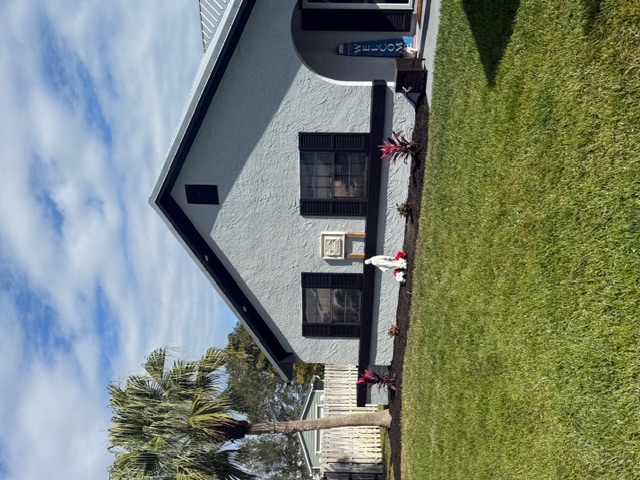 Jensen Beach painting company project - elegant home with black trim